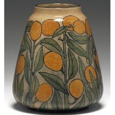 a vase with oranges painted on it