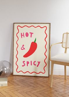 a hot and spicy sign sitting on top of a wooden floor next to a chair