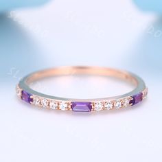 an image of a purple and white diamond ring