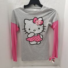 New With Tags Size Xl By Hello Kitty Sanrio Long Sleeve Under T-Shirt Look Though It Is The Same Shirt Grey Shirt Pink Sleeves Hello Kitty Printed On Shirt 3d Flower Tee 90% Cotton & 10% Polyester Sleevesn Some Measurements: Under Arm To Under Arm About 15.5" Middle Collar Back To Middle Hem About 25.5" Hem Across About 17" Shoulder To Shoulder About 15" Shoulder To Seam Of Sleeve About 23.5" Long Sleeve Under T Shirt, Kitty Clothes, Hello Kitty Clothes, Hello Kitty Sanrio, Girls T Shirt, Grey Shirt, Cat Shirts, Long Shirt, Polka Dot Dress