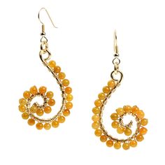 The exotic beauty of Yellow Jade never goes out of style. These 14K Gold-filled Wire-wrapped Dangle Earrings will capture your love for the unique, while providing you with a splash of color. Pair them with your favorite ring for a look that is both captivating and enchantingly you. Brighten up your ensemble with these bold earrings! .Measures approximately 2 1/4 inches in Length x 1 1/4 inches in Width 14K Gold-filled French Wires, for pierced ears only. Gift Boxed. Elegant Gold Wire Wrapped Wrap Earrings, Wire Wrapped Spiral Jewelry, Unique Gold Wire Wrapped Earrings, Yellow Gold Wire Wrapped Dangle Earrings, Bohemian Yellow Gold Wire-wrapped Earrings, Unique Hand Wrapped Drop Earrings, Bohemian Yellow Gold Wire Wrapped Earrings, Elegant Spiral Hand Wrapped Jewelry, Gold Hand Wrapped Dangle Earrings