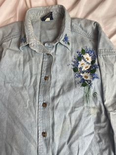 Hand painted denim long sleeve. Design on left breast area, along with the color. Super unique, an eye catcher. All buttons are completely in tact. 100% cotton Medium Wash Cotton Denim Jacket With Buttons, Washed Blue Cotton Denim Jacket With Buttons, Denim Blue Cotton Jacket With Long Sleeves, Vintage Long Sleeve Denim Top With Button Closure, Light Wash Cotton Button-up Denim Jacket, Medium Wash Long Sleeve Denim Top With Buttons, Medium Wash Denim Top With Buttons And Long Sleeves, Blue Washed Long Sleeve Denim Top, Medium Wash Denim Top With Buttons