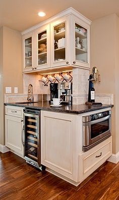 the kitchen is clean and ready to be used as a wine bar or appliance