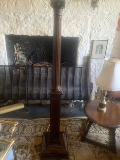 a grandfather clock sitting in the middle of a living room