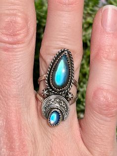 Here is one of a kind Moon Crescent ring! This double band ring features a beautiful Labradorite and tiny Moonstone.  The moon is made in Fine Silver, while everything else is done in Sterling Silver.  Stamped .925 on the back side.  Size 6. *Free USPS Priority Shipping within the U.S.  Please message me if you're interested in purchasing and live outside of the United States - I will find the additional shipping cost. Thank you very much for your interest in my work * Whether for yourself or as a gift to a loved one, I create each piece with care in hopes that it may be treasured by its new owner.  Please note, due to the nature of hand crafted jewelry, there might be minor imperfections caused by my tools.   * Sterling Silver will naturally tarnish over time.  To help prevent tarnishing, Adjustable Mystical Labradorite Rings, Adjustable Moon Shaped Bohemian Rings, Bohemian Adjustable Moon-shaped Rings, Bohemian Moon Shaped Adjustable Rings, Handmade Celestial Moonstone Ring In Moon Shape, Artisan Moonstone Ring With Natural Stones, Adjustable Bohemian Moonstone Ring In Sterling Silver, Bohemian Open Ring With Moon Phase Detail, Mystical Labradorite Ring Jewelry