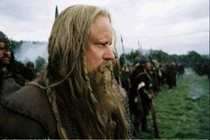 a group of men with long hair and beards