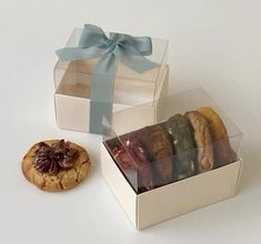 an open box filled with cookies next to a cookie