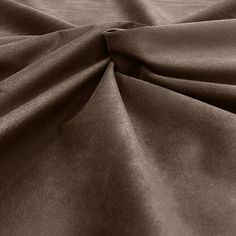 a close up view of the fabric on a bed