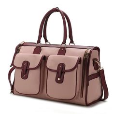 Introducing the stylish Genevieve Duffle Bag, your go-to weekender for effortless travel. Made from pebbled vegan leather with color block trim, this chic carryall offers ample space and safety with its top zipper. Unleash its one-compartment interior to discover a fully lined space with two slip pockets and a wall-zippered pocket. The luxurious gold-tone embellishments add a touch of elegance, while the exterior features include side zippered pockets, two front deep pockets, and a trolley slee Leather Duffle Bag, Boot Jewelry, Leather Duffle, Vegan Leather Bag, Baby Sneakers, Women Men Shoes, Weekender Bag, Duffel Bag, Pink Bag