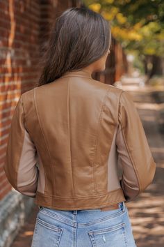 Add an edgy twist to your outerwear collection with the Brown Two Tone Faux Leather Jacket. This versatile piece combines a bold two-tone design with the sleek look of faux leather, creating the perfect jacket for the modern boho woman. Whether you're layering it over a dress for a night out or styling it with jeans for a casual day look, this jacket adds a perfect mix of attitude and sophistication to your wardrobe. Trendy Brown Fitted Leather Jacket, Trendy Fitted Brown Leather Jacket, Fitted Brown Faux Leather Outerwear, Beige Leather Biker Jacket For Fall, Trendy Brown Faux Leather Biker Jacket, Brown Faux Leather Jacket For Fall, Fitted Fall Outerwear With Color Block, Chic Leather Jacket For Layering, Brown Faux Leather Jacket For Spring