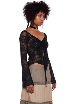 This long sleeve top has a sheer lace construction, a ruched bust with a self-tie closure, long sleeves with bell cuffs, lettuce trim, and a handkerchief hem. Current Mood Clothing, Windsor Smith, Pride Outfit, Dolls Kill, Black Laces, Sheer Lace, Exclusive Collection, Lace Tops, Online Boutique