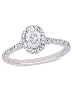 an oval cut diamond ring with pave set shoulders