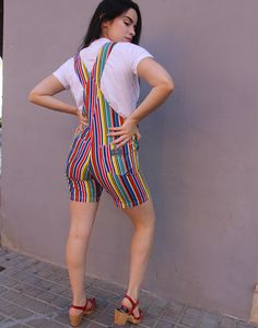 Vintage dungaree shorts in a multi colour stripe. Single chest pocket. Front and back lower pockets. Adjustable shoulder straps. Size small, UK 6-8 / EUR 34-36. Measurements - 7"(18cm) bib height - 13"(33cm) bib width - 28"(71cm) waist - 34"(87cm) hips - 7"(18cm) inner leg. Material - Cotton. Condition - Excellent. Handpicked, repaired and ready to wear. This is an original vintage item, not new and minor signs of wear & age are expected, we will highlight any major flaws.Model is a UK 8 and is 5'6" tall. Striped Overalls With Pockets For Summer, Dungaree Shorts, Womens Denim Overalls, Overalls Denim, Dungarees Shorts, Womens Denim, Denim Romper, Denim Overalls, Color Stripes