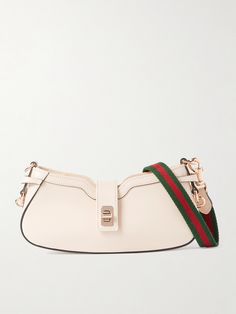 This shoulder bag is unmistakably Gucci thanks to the signature striped webbing strap which is detachable so you can carry it as a clutch, too. It's crafted from smooth cream leather and has a structured curved base and branded gold-tone hardware. Inside, you'll find enough space for your cardholder, mascara and mirror compact. Mirror Compact, Eyewear Shop, Webbing Strap, Winter Beauty, Ballet Pumps, Beauty Sets, Clothes Collection, Beauty Accessories, Net A Porter