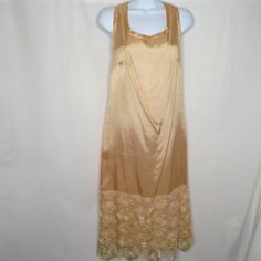 Vintage 60s/70s Peach Taffeta Lace Tea Party Dress L Sleeveless Tank Gatsby Downton 20s Brand: Endien Ltd. New York Paris Made In Usa Tag Size: 14 = Measures Large Taffeta With Wide 13" Gold Brocade Scalloped Lace Hem Measurements: Chest: 20" Across Underarms Waist: 19" Hips: 21" Length: 45" Shoulder To Hem Excellent Vintage Condition, Does Have Light Stains That Should Come Out With Proper Cleaning Item#000/050721 Features: Dress Size: Womens L Condition: Pre-Owned Good Sleeveless Silk Dress With Lace Trim, Sleeveless Retro Vintage Dress With Lace Trim, Retro Sleeveless Vintage Dress With Lace Trim, Vintage Satin Summer Dresses, Elegant Sleeveless Vintage Dress For Spring, Apricot Sleeveless Evening Dress, Vintage Apricot Party Dress, Sleeveless Vintage Dress With Lace Trim For Spring, Spring Wedding Sleeveless Vintage Dress