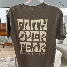 Faith over fear graphic t-shirt. Color: espresso with cream writing. unisex sizing 100% ringspun cotton Recommended Care Instructions Machine wash delicate cycle, cold/warm, inside out with like colors. Do not bleach. Remove immediately after washing. Tumble dry on low or hang dry. Do not iron decal. Do not dry clean. Fca Shirt Ideas, Fca Shirts Design, God T Shirts, Cute Christian Shirt Designs, Christian Tshirt Design Ideas Vinyl, God T Shirt Design, Unisex Tshirt Design, Church T Shirts, Godly Shirts