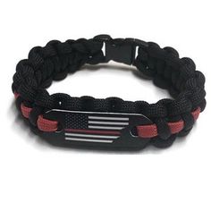 a black and red paracorine bracelet with an american flag on the side,