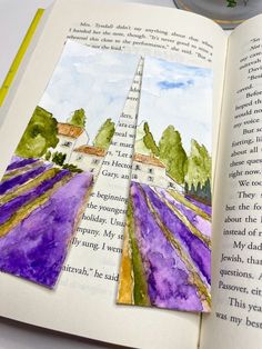 an open book with watercolor paintings on it