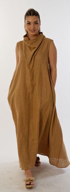 Introducing the impeccably stylish and comfortable maxi long linen dress that exudes charm and draws you in instantly. It combines the carefreeness of a casually draped neckline with an avant-garde and sophisticated style that adds a striking accent to your look. Made entirely from 100% linen, this sleeveless dress flaunts its arms with its unique appeal. Its asymmetric hem adds extra freshness and eccentricity to your look, while the interesting neckline adds sophistication and tenderness to the overall look. The hidden zipper on the back ensures easy dressing and excellent fixation of the dress. With its side pockets and extra volume at the sides, this elegant dress gives you and your style some confidence and functionality. Combining the natural beauty of linen with premium craftsmanshi Beige Linen Dress Solid Color, Beach Ramie Linen Dress, Beige Linen Solid Color Dress, Solid Linen Maxi Dress For Vacation, Beige Relaxed Fit Maxi Dress, Solid Linen V-neck Maxi Dress, Vacation Linen Dress Solid Color, Chic Linen Maxi Dress With Relaxed Fit, Plain Linen Beach Dress