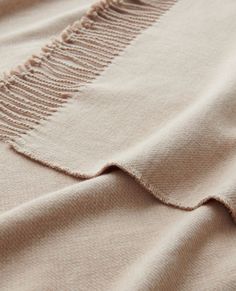 a close up view of an unbuttoned sweater