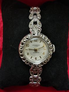 Amazing Jewels women watch Case size :2cm Thickness :8mm Max size wrist 20cm Type bracelet and case,, Marcasite" Manual Wind  Prophylaxis of watchmaker  Made in Britain Shockproof Very good condition Vintage Metal Round Watch Accessories, Vintage Metal Round Jewelry And Watches, Vintage Adjustable Metal Watch Accessories, Vintage Metal Watch Accessories, Vintage Hallmarked Watches For Evening, Vintage Silver Watch Accessories, Vintage Silver Metal Jewelry And Watches, Vintage Metal Jewelry And Watches For Formal Occasions, Vintage Engraved Round Jewelry And Watches