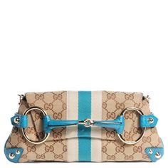 Here is everything you need to know about the Gucci Horsebit Chain Clutch, how it evolved from a Tom Ford-era icon into a modern-day classic. Turquoise Interior, Web Panel, Gucci Clutch, Gucci Horsebit, Turquoise Leather, Vuitton Bag, Diaper Backpack, Exclusive Bag, Casual Backpack