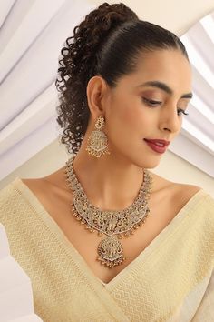 Gold plated temple long necklace with stone studded carved radha-krishna motifs. Comes with pair of earrings. - Aza Fashions Necklace With Stone, Temple Necklace, Jewellery Sets, Stone Studs, Gold Brass, Radha Krishna, Aza Fashion, Long Necklace, Krishna