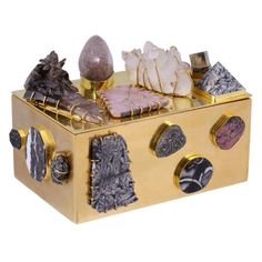 a gold box filled with different types of rocks