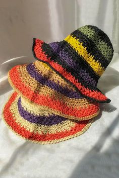 Packable crochet straw bucket hat with multi color stripes. Also comes with a size adjuster inside. Made of 100% straw. Can be folded very small to fit in your purse. Made In: China