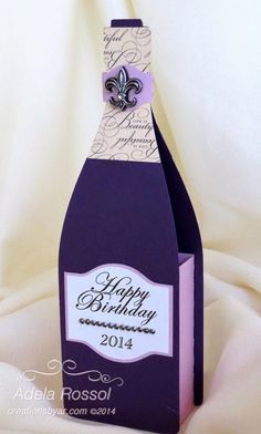 a purple bottle with a bow on it