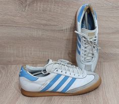 Welcome to our store.  Antique Adidas Beckenbauer Allround Sneakers Size: US 10.5 | 10 UK/ 44.5 EUR/ Vintage Adidas Beckenbauer Allround Shoe/ Vintage Clothing men Please make sure of the measurements and do not be satisfied with the written sizes because they differ from country to country. Size:  US 10.5/ 10 UK/ 44.5 EUR Condition:          8/10 This item is used but in good condition. If there are any nuances - they will be listed in the description of the goods and indicated in the photo! Please carefully read the description of the goods and see the photo. They can indicate all the nuances of the item. All items are used and may have signs of use. ONLY 100% AUTHENTIC ITEMS! We try as hard as we can to bring the picture's color closer to reality, but the best cameras are not the same a Retro Adidas Shoes, Adidas Leather Shoes, Adidas Beckenbauer, Adidas Retro, Adidas Vintage, Vintage Clothing Men, Trainer Sneakers, Clothing Men, Best Camera