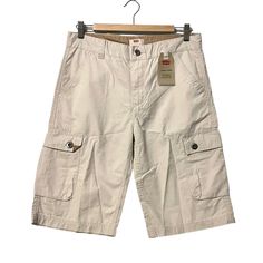 Levi's Cargo Shorts Falls Below Knee Cream Youth Size 18 Regular 29 Waist New With Tags Extra Room In Seat And Thigh 2 Side Pockets 2 Cargo Pocket With Button Close 2 Back Pockets With Button Close Normcore Casual 100% Cottom Comfortable Breathable Material Made In Vietnam 0390 Cargo Pants Youth, Cheap Cargo Shorts, Where To Get Cargo Shorts, Beige Short Leg Pants With Pockets, Cotton Cargo Shorts With Pockets, Spring Cargo Shorts With Short Leg, Short Cotton Cargo Pants For Spring, Spring Bermuda Cotton Cargo Pants, White Cargo Shorts For Spring