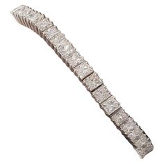 A bracelet fit for a princess, or your queen! Luxuriously fashioned of high-quality 18 Karat white gold, this spectacular Tennis bracelet is elegant enough to be worn at any Hollywood red-carpet event. This bracelet features an astounding 20.66 carat total sparkling VS quality princess cut diamonds set in 4 prongs into a linear row. The tennis bracelet is big, versatile, elegant and is sure to turn heads and start interesting conversations. What a way to set yourself apart with a bracelet full o Expensive Jewelry Luxury, Princess Cut Gold, Antique Bracelets, Diamond Bangles Bracelet, Diamond Tennis Bracelet, Princess Cut Diamond, Expensive Jewelry, Tennis Bracelet Diamond, Women Diamond