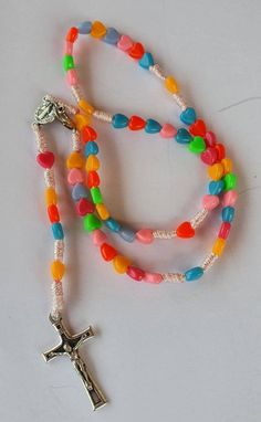 a multicolored rosary with a cross on it