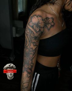 a woman with a flower tattoo on her arm