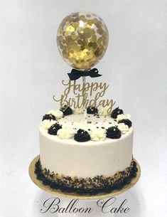 a birthday cake with a balloon on top