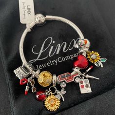 a charm bracelet with charms on it