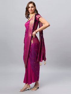 Is it a Saree or is it a Sarong? You decide! The Rubia Magenta Sarong Saree is made of luxurious Banarasi Saree and is designed in a fully wrap-around, tie and go style - as easy as a wrap-around skirt, as sophisticated as a saree! The blouse is optional and sold separately. Watch the video to see how easy it is! About this Product Sarong Saree: Saree Color: Pink and Navy Tie-dye Saree Fabric: Modal Satin Type of Work: Shibori Sizing: comes in 2 free & adjustable sizes Blouse: Included Blouse Style: As seen in Image - Custom blouse available on request Blouse Color: Pink Blouse Fabric: Modal Satin Blouse Material: 0.8 meters Steps To Wear Guide: Place the label on the center back Wrap the skirt around & put the waist band belt through the buttonhole from inside to outside & tie it on your Elegant Choli With Sheer Dupatta For Puja, Traditional Formal Blouse With Sheer Dupatta, Transitional Semi-stitched Brocade Pre-draped Saree, Traditional Blouse With Sheer Dupatta For Puja, Festival Blouse With Sheer Dupatta For Puja, Elegant Blouse Piece With Sheer Dupatta For Puja, Fitted Blouse Piece With Sheer Dupatta For Puja, Traditional Pre-draped Saree With Self Design, Formal Pre-draped Saree With Unstitched Blouse For Transitional Season