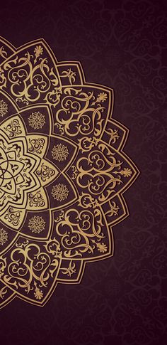 an ornate gold pattern on a maroon background