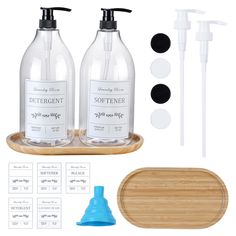 two bottles with soap dispensers on a wooden tray next to other items