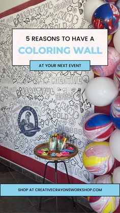 a room filled with balloons and wall art