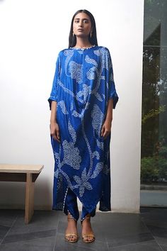 Blue batwing sleeves asymmetric hem kurta with all over bandhani tulip pattern and cowrie shells, metal coins embellishments on the neckline. Paired with a dhoti pant. - Aza Fashions Blue Traditional Drape Kurta For Summer, Kurta With Dhoti, Tulip Pattern, Stylish Lifestyle, Pant Women, Dhoti Pants, Women Kurta, Kurta Dress, Cowrie Shells