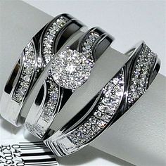 two wedding rings with diamonds on top of each other