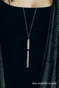 Bold and a little bit edgy, our long gold Swarovski tassel necklace will be your new favorite piece of jewelry. Perfect for a night out on the town or just to dress up a casual outfit, this necklace will add sparkle and sophistication to your wardrobe. Complete the look with the matching earrings which you can find here. Details The necklace is 32" long. The Swarovski tube bead is 30mm long. The pendant drop is about 3.25" long. Because of the length of the necklace, there is no clasp. Materials Metal Tassel Necklace With Adjustable Chain For Parties, Metal Tassel Necklace For Party, Party Tassel Necklace With Adjustable Chain, Silver Metal Tassel Necklace For Party, Long Tassel Necklace For Party, Silver Metal Necklaces For Night Out, Chic Dangle Lariat Necklace For Party, Chic Lariat Dangle Necklace For Parties, Silver Necklaces With Adjustable Length For Parties