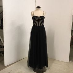 Stunning Black And Peekaboo Full Length Party Dress. Size 6. Perfect Condition - Never Worn! Black Tulle Evening Dress With Boned Bodice, Black Evening Dress With Fitted Lined Bodice, Black Sheer A-line Dress, Sheer A-line Dress For Night Out, Party Dress With Boned Bodice And Tulle Material, Black Floor-length Evening Dress With Boned Bodice, Black Evening Dress With Boned Bodice For Prom, Strapless Party Dress With Sheer Bodice, Black Tulle A-line Evening Dress