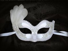 White Embroidery Masquerade Mask With Feathers White Lace White Formal Masquerade Mask For Carnival, White Fantasy Eye Mask, White Eye Mask For Costume Party, Elegant White Eye Mask, White Venetian Masks For Masquerade, White Eye Mask For Carnival, Elegant White Masquerade Mask For Weddings, White Eye Mask For Masquerade, Elegant White Masquerade Mask