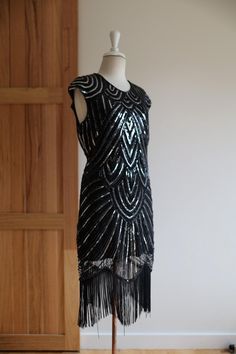 Stunning black and silver flapper, 20s style dress.  Embellished with sequins all over this is a dazzling party dress.  Cap sleeves and a higher cut neckline provide flattering coverage.  An easy stretch fabric will fit a size 8-10 UK 20s Fashion Dresses, Style Année 20, Flapper Style Dresses, 20s Style, Easy Stretches, 20s Fashion, Flapper Style, Silver Sequin, Dress Clothes For Women