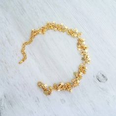 Tiny clusters of matte gold finish miniature star fringe, finished with an adjustable chain and lobster claw clasp. 14k gold plated brass. { M e a s u r e m e n t s } Bracelet shown adjusts to fit approx 6.25 - 8 in (15 - 19.5cm). Each little star is approx 1/4 inch {approx 5mm} tall. Please double check measurements on your own wrist prior to any purchase, if you have any doubt or concern about the fit. I'm happy to shorten the length free of charge if you leave me a note at checkout with your Dainty Adjustable Chain Bracelet With Star Charm, Adjustable Gold Chain Bracelet With Star Charm, Adjustable Gold Star-shaped Chain Bracelet, Adjustable Gold Star Chain Bracelet, Gold Star Charm Chain Bracelet, Gold Chain Bracelet With Star Charm, Gold Charm Bracelet With Star Charm As A Gift, Gold Bracelets With Star Charm For Gift, Gold Bracelet With Star Charm For Gift