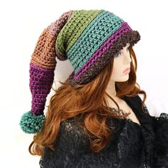 "Make winter fun with this thick and warm witchy stocking hat. I've crocheted this with a chunky yarn and a brown Sherpa brim that can be pulled down over your ears. 21\" long from the tip to the brim, this hat has enough body that it can be worn with the tip hanging down or tucked into a more upright shape, and the end has a matching pom pom. Certain to add fun character to your winter outdoor wear or gift to a friend who needs that extra warmth. Works for him or her! Lots of stretch, so one si Whimsical Knitted Winter Beanie, Whimsical Winter Knitted Beanie, Adjustable Knitted Winter Costume Hats And Headpieces, Whimsical Beanie For Winter, Adjustable Knitted Costume Hats And Headpieces For Winter, Fun Winter Crochet Beanie Hat, Whimsical One-size Beanie For Winter, Fun Crochet Beanie For Winter, Fun Crochet Beanie Hat For Winter