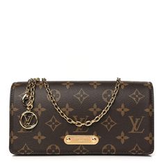 This is an authentic LOUIS VUITTON Monogram Lily Wallet On Chain. This compact wallet is crafted ofLouis Vuitton monogram coated canvas in brown. The bag features an optional, an adjustable removable chain strap with an LV logo pendant, and gold hardware. This opens to a brown microfiber interior with a leather patch pocket and card slots. Lv Logo, Compact Wallet, Wallet On Chain, Leather Patches, Authentic Louis Vuitton, Chain Strap, Gold Hardware, Louis Vuitton Monogram, Patch Pocket